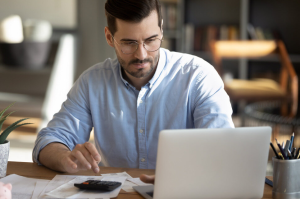 A person researching new cars online near Indianapolis, Indiana.