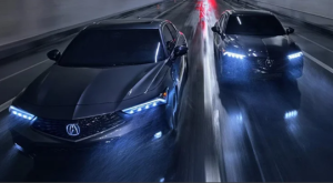 A pair of 2024 Acura Integra vehicles driving alongside each other near Indianapolis, Indiana