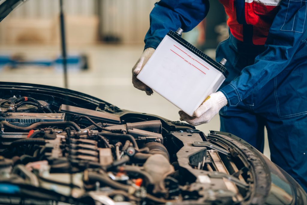 A technician replacing Battery from Acura vehicle.