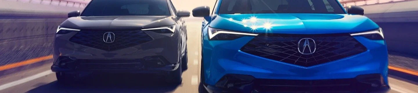 Two Acura models driving side by side on a highway, seen head-on